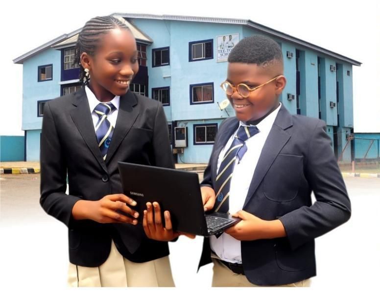 Tee-Tops College students working together on a laptop