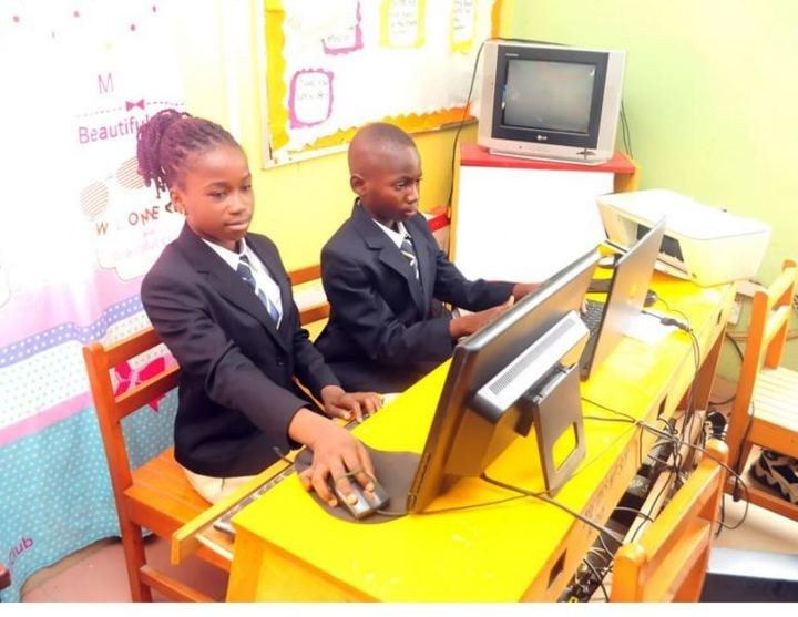 Students at computers in the ICT room