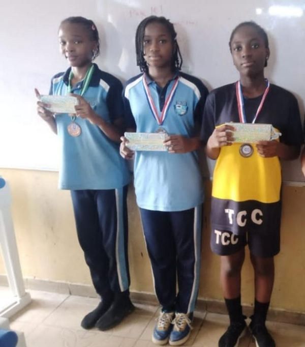 Tee-Tops students holding their medals